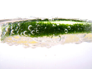 Slice of lime in glass of soda water