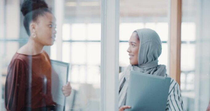 Business, happy women and discussion while walking in office for teamwork, collaboration and chat. Diversity, female employees and talking in conversation, speaking and networking in global company