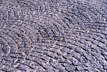 Background of old cobble stone granite pavement