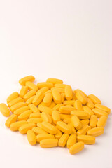 Multiple Pills or tablets against a plain background