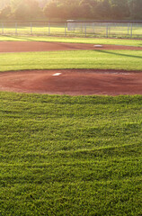 A baseball field cast in early morning light.