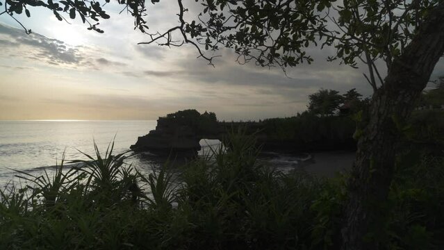 Tanah Lot, traditional Balinese temple and Indian Ocean during golden hour, Bali, Indonesia, South East Asia