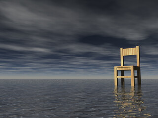 chair in the water and dark sky