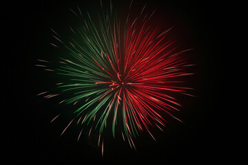 A red and green, round fireworks burst.