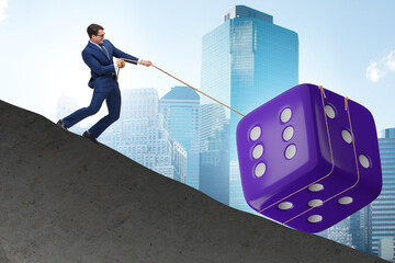 Uncertainty concept with businessman and dice
