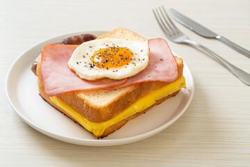 bread toasted cheese topped ham and fried egg with pork sausage