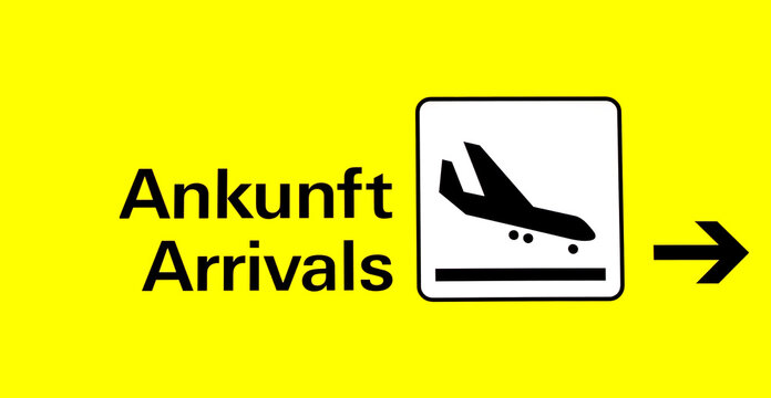 arrival board at the airport in german and english