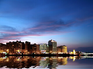 Fototapeta na wymiar City Coastline at dusk in Malta