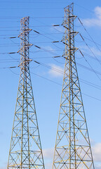 Twin power towers against a sky background