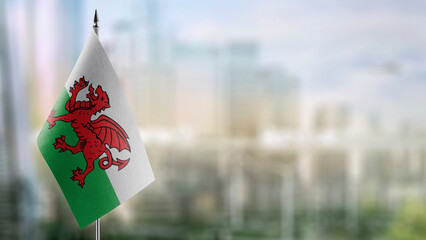 A small Wales flag on an abstract blurry background