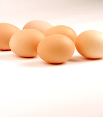 Multiple Eggs set against a plain background
