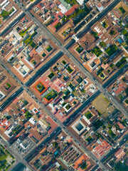 Aerial top down drone photo of square city blocks in old city in Latin America. Bird's eye view of Antigua, Guatemala.