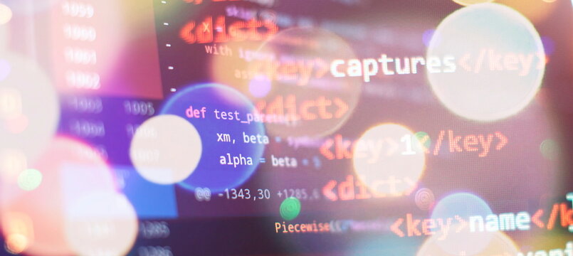 Programmer working on javascript computer code with virtual screen. Programming code technology.