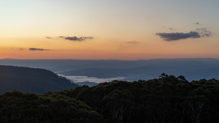 sunrise over the mountains with some fog