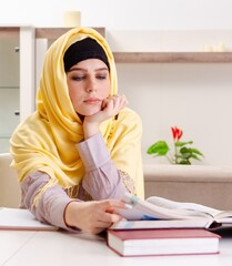 Female student in hijab preparing for exams