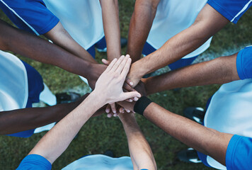 Hands stacked, above and men on a soccer field for support, motivation and team spirit. Sports,...