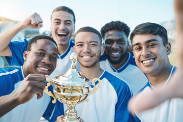 Sports group, soccer trophy and selfie of team on field for game award or prize outdoor. Football...