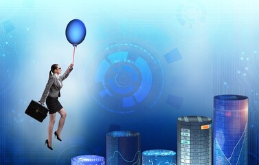 Businesswoman flying on hot balloon over graph