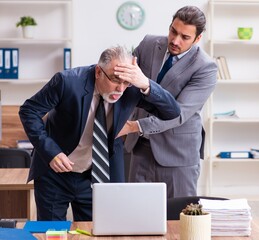 Two employees in pandemic concept at workplace