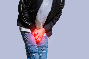 Man with urinary incontinence. Medical problem, Close-up of a Young man with pain in the crotch,...