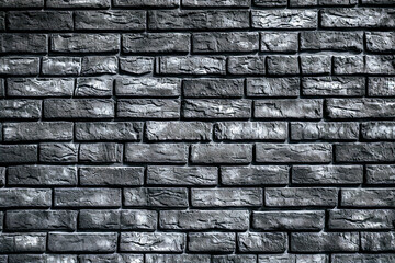 Texture of a black painted brick wall as a background