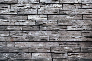 Texture of a black painted brick wall as a background