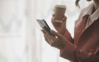 Beautiful female call center operator working on computer in office