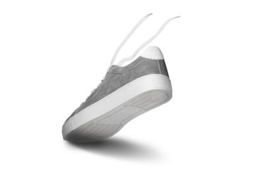 Leather grey color men's sneakers with white lace and rubber soles isolated on white background