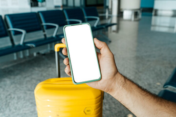 Using phone in travelling. Blank screen smartphone at the airport before the flight. Application...