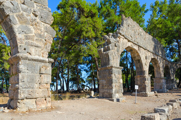 Ruins of aqueduct in ancient city of Phaselis near Camyuva, Turkey