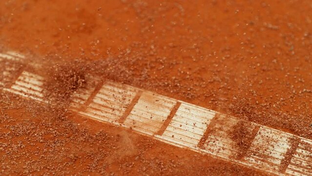 Super slow motion of Tennis ball ping on clay court inside or outside white line. Filmed on high speed cinematic camera at 1000 fps.