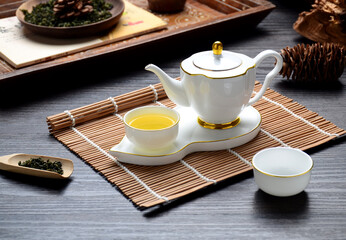 White tea set on the table, tea for relaxation and self-care. Tea flavor profiles by brewing...