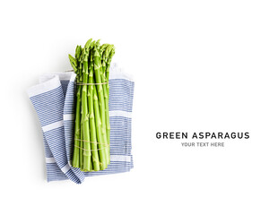 Fresh green asparagus bunch and kitchen cloth creative layout isolated on white background.