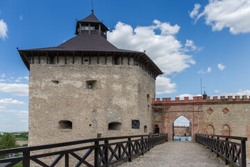 Fototapeta na wymiar Knight's tower and main entrance of medieval Medzhybizh Castle, Ukraine
