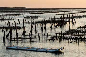 Sunset view of the Z-shaped Oyster sheds in front of Guanhai House in the Qigu Lagoon of Tainan, Taiwan.  © BINGJHEN