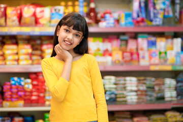 Indian girl purchasing at grocery shop
