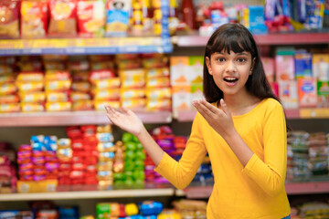 Indian girl giving shocking reaction at grocery shop.