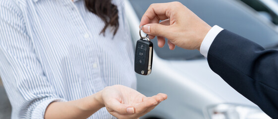 lease, rental car, sell, buy. Dealership manager send car keys to the new owner.  Sales, loan credit financial, rent vehicle, insurance,  renting, Seller, dealer, installment, car care business