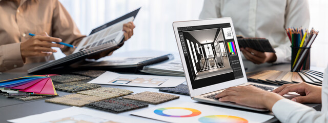 Group of interior architect designer team at table choosing color samples with architecture...