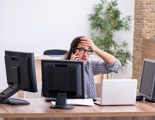 Young male it specialist working in the office