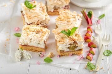 Homemade rhubarb yeast cake with foam and crumble.