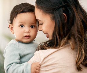 Love, portrait and mother with baby, smile and playing during morning bonding routine in their home together. Family, face and mom with girl toddler in living room having fun, embrace and relax