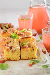 Sweet and delicious rhubarb yeast cake served as summer dessert.