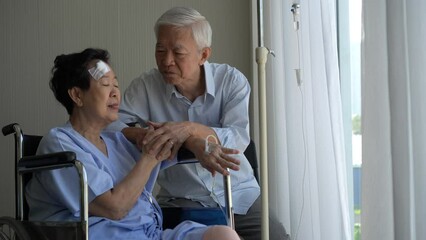 Asian senior love couple support care husband visit accident injure wife at hospital good partner relationship - Powered by Adobe
