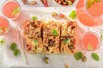 Homemade and sweet rhubarb yeast cake served as summer dessert.