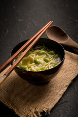 japanese soup with noodles and edamame
