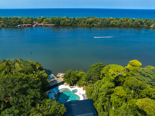 Luxury lodge in the middle of the jungle in Tortuguero, Costa Rica. Caribbean sea on the one side, village inside the jungle in the middle, and huge river on the otjer side.