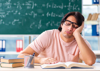 Young male student in the classroom