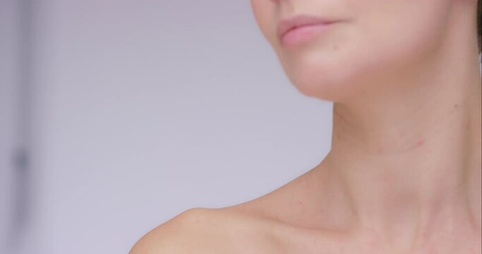 Face, hand on skin and beauty of a woman in studio for skincare, natural glow and health cosmetics. Headshot of aesthetic model person with facial results, dermatology transformation and wellness