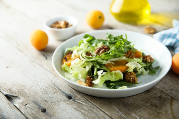 Healthy leaf salad with apricot and walnut